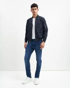 7 For All Mankind Luxe Performance Plus Slimmy Tapered In Mid-Blue -Sleek Fit Style 22ce3178b8e1be41ffec2c7801a67cfb